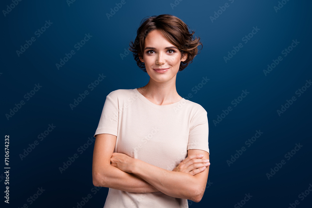 Portrait photo of adorable young girl business manager entrepreneur hold arms folded isolated on dark blue color background Portrait photo of adorable young girl business manager entrepreneur hold arms folded isolated on dark blue color background