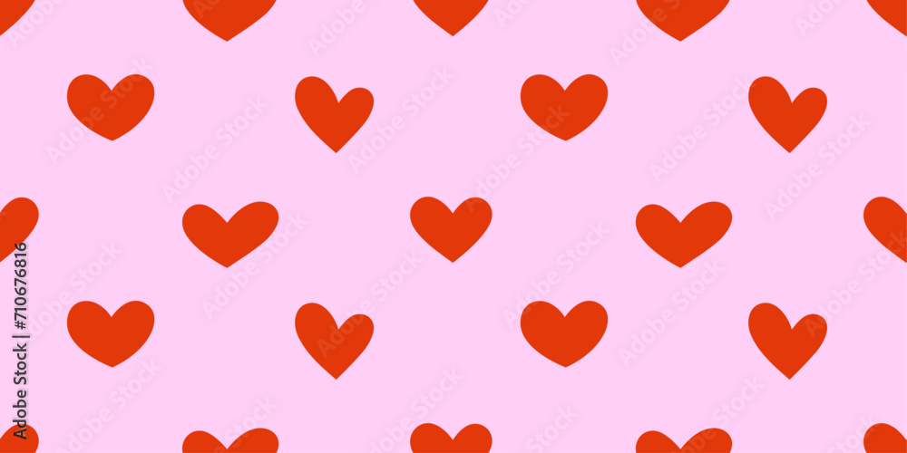 Seamless pattern with red hearts. Red hearts on pink background. 