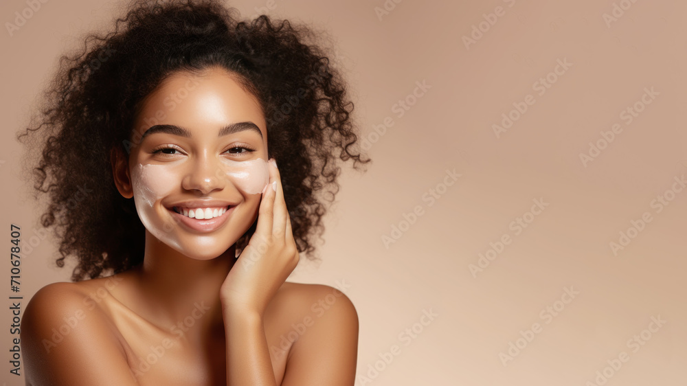 Afro woman with a healthy glowing skin is applying a skincare product. Afro woman with a healthy glowing skin is applying a skincare product.