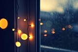 string of fairy lights at a window, in the evening - cozy late night vibes