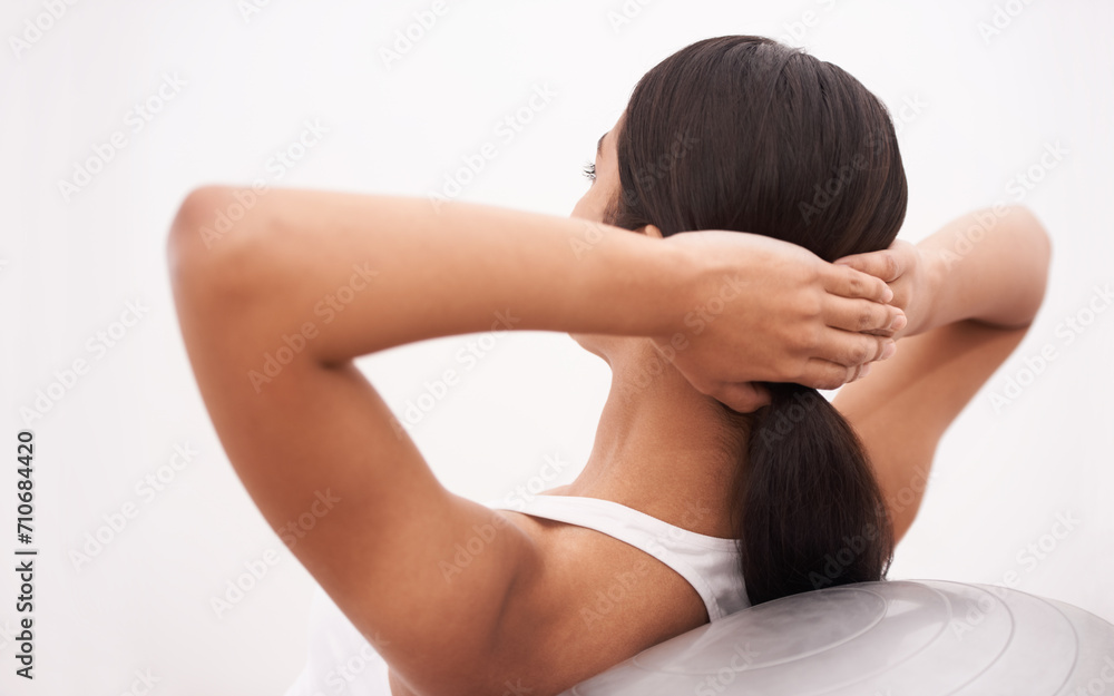 Fitness, exercise and woman with gym ball, commitment and energy for health, wellness and training. Workout, pilates and girl with equipment for balance, weight loss and body care on white background Fitness, exercise and woman with gym ball, commitment and energy for health, wellness and training. Workout, pilates and girl with equipment for balance, weight loss and body care on white background