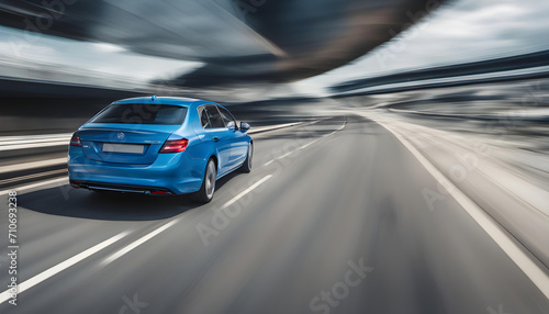 High-Speed Business Car: Captivating Rear View of a Blue Car Racing on a Highway