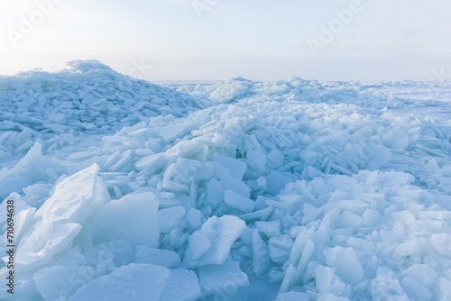Winter landscape with frozen sea and ice hummocks