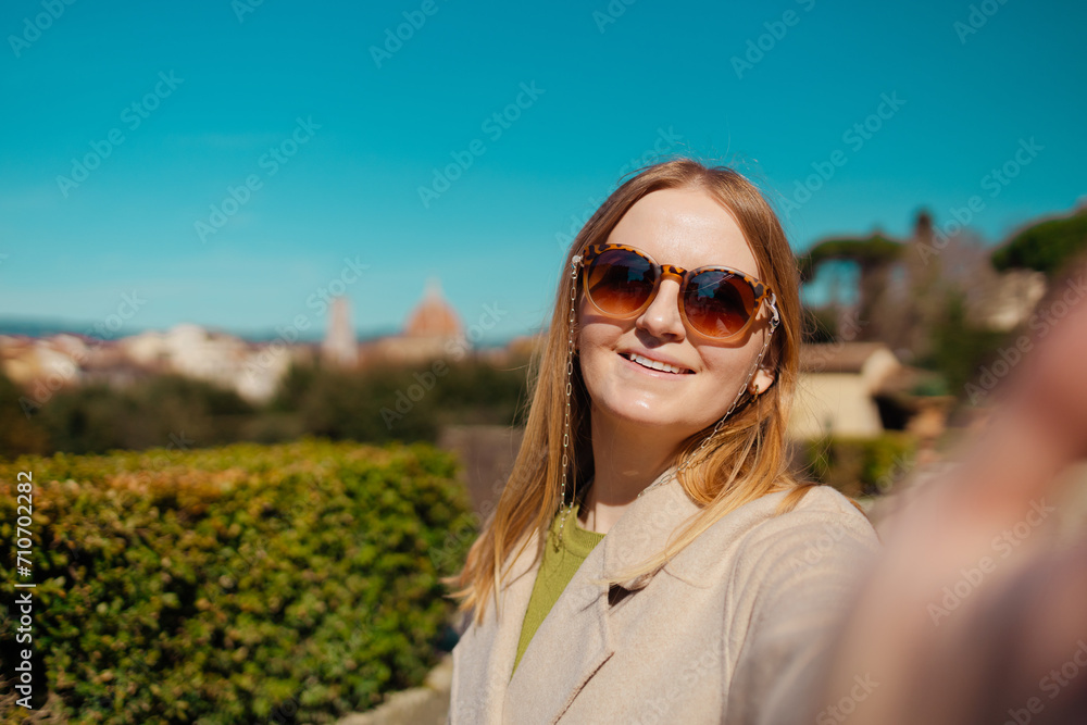 Portrait of wonderful white female model expressing energy in good day in Europe.Female making selfie while walking outdoors. High quality photo Portrait of wonderful white female model expressing energy in good day in Europe.Female making selfie while walking outdoors. High quality photo