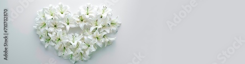 wedding or memorial bouquet of white lilies. heart shaped flower arrangement. horizontal wallpaper with large copy space for text. Condolence, grieving card, loss, funerals, support, wedding 