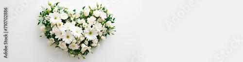 wedding bouquet of white lilies. heart shaped flower arrangement. horizontal wallpaper with large copy space for text. Condolence, grieving card, loss, funerals, support