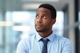 Black History Month, Head shot thoughtful african american businessman looking away. Manager thinking of problem solution at office.