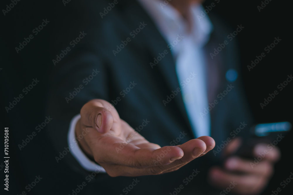 Businessmen work and reach out and work with their smartphones with gestures.