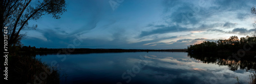 Panorama. Dusk on the lake. Rainy day near the lake.