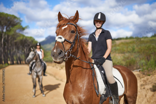Woman, horse and countryside for horseback riding in texas, rider and sport training for performance. Farm, rural and nature in outdoor, adventure and animal in gravel, pet care and dirt road