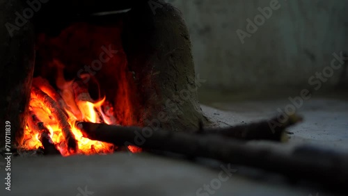 firebrand or bonfire with bowler, Static shot of pot over campfire in hut, cooking in Indian style. Static photo