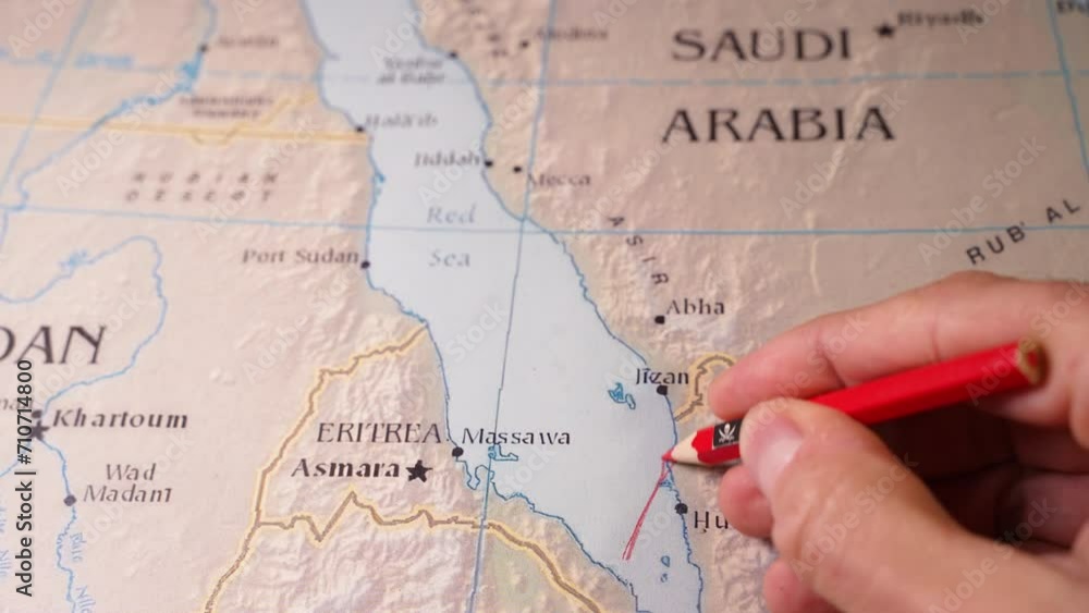 hand drawing a red line and closing the maritime passage through the Red Sea. Concept of Attacks by Pirates and Iran-backed militants in the Red Sea and the Houthi strikes. hand drawing a red line and closing the maritime passage through the Red Sea. Concept of Attacks by Pirates and Iran-backed militants in the Red Sea and the Houthi strikes.