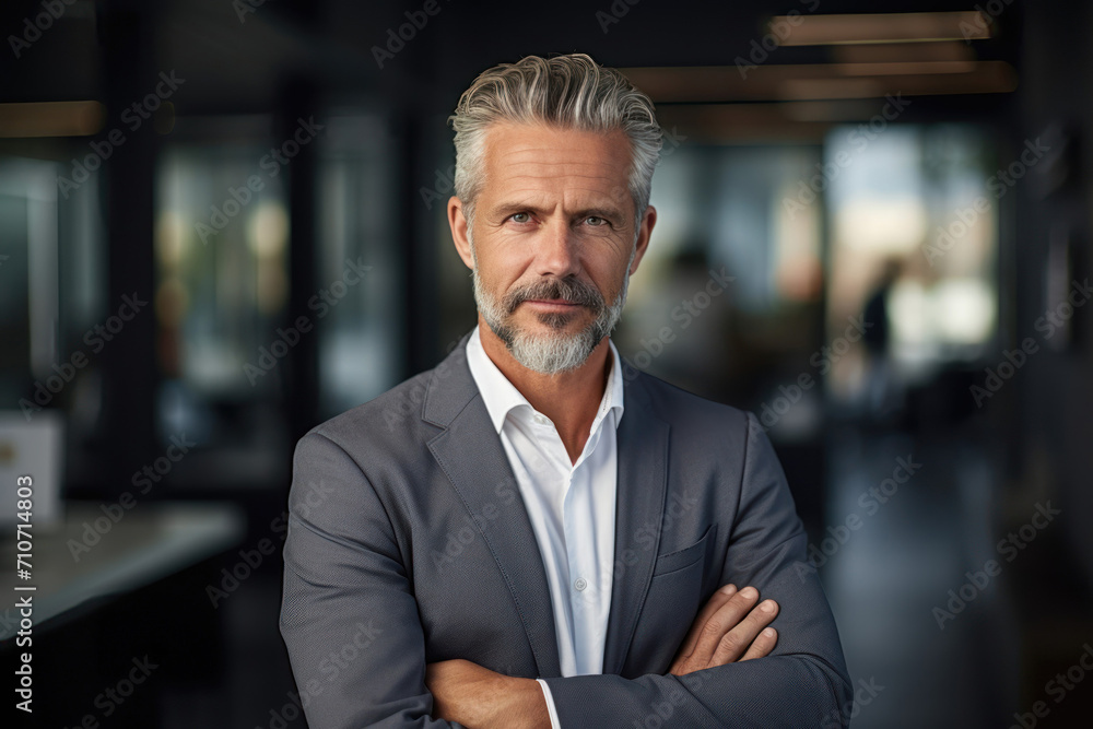 Mid Aged Businessman with Confident Stance in Office Mid Aged Businessman with Confident Stance in Office