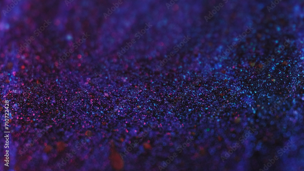 Fototapeta premium Sparkling paint flow. Glitter drops. Defocused blue red purple black color shimmering texture ink fluid wave motion abstract art background.