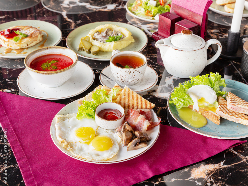 Breakfast, assorted breakfast dishes in a cafe.