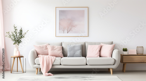 A modern living room's interior design features a grey sofa adorned with pink pillows and a blanket against a white wall with an abstract art poster. © Simo