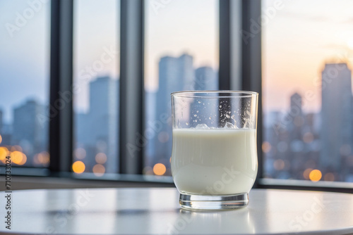 photo of milk in front of a window with a view of the city 11 photo