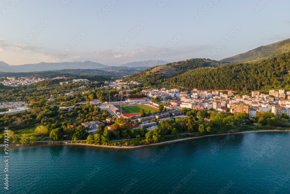 Aerial view Igoumenitsa Municipal stadium along the bay at sunset, Epirus, Greece. Aerial view Igoumenitsa Municipal stadium along the bay at sunset, Epirus, Greece.