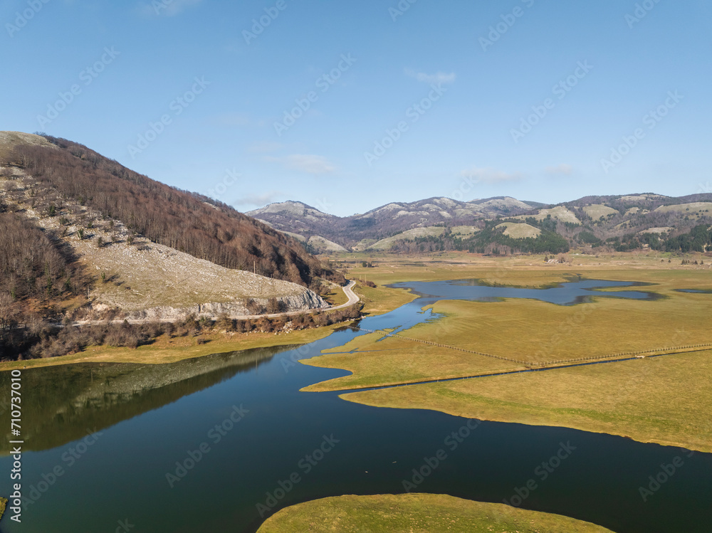 Aerial view of Laceno Lake (Lago Laceno), a reservoir on high altitude mountain in Bagnoli Irpino, Avellino, Irpinia, Campania, Italy. Aerial view of Laceno Lake (Lago Laceno), a reservoir on high altitude mountain in Bagnoli Irpino, Avellino, Irpinia, Campania, Italy.
