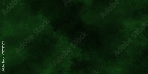 Elegant green background with marbled texture; old vintage grunge design; green Christmas background;Paint stains with spots, blots, grains, splashes. Colorful wallpaper. 