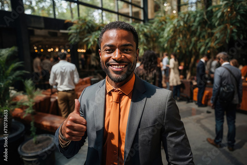 African American man with his thumb up in a meeting