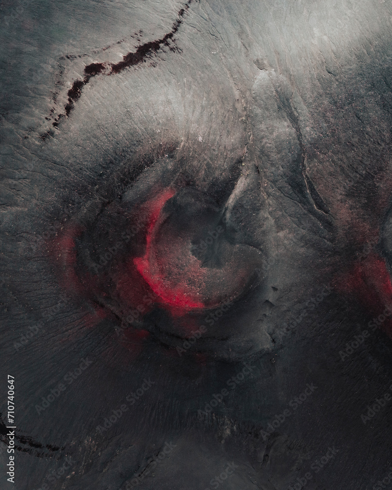 Aerial drone top-down view of red coloured volcanic craters in the highlands of Iceland.