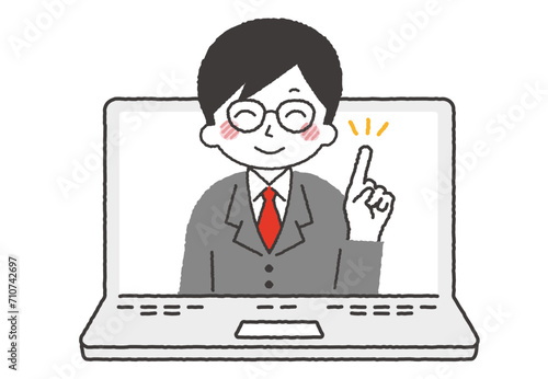 パソコンと男性講師。オンラインやリモートで説明をしている社会人。
