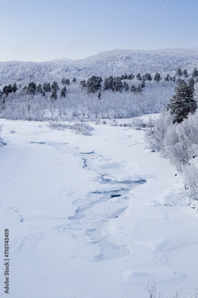 Frozen river in Abisko Nationalpark in winter scenery. Sweden, Arctic Circle, Swedish Lapland Frozen river in Abisko Nationalpark in winter scenery. Sweden, Arctic Circle, Swedish Lapland