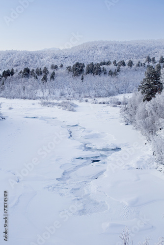 Frozen river in Abisko Nationalpark in winter scenery. Sweden, Arctic Circle, Swedish Lapland