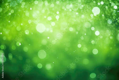 Abstract blurred green background with light bokeh