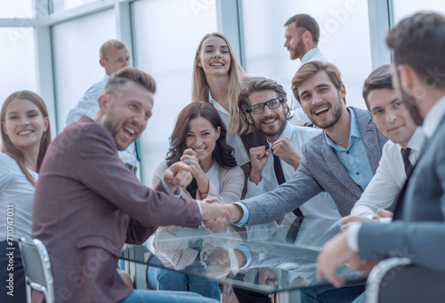 happy business people shaking hands in the conference room