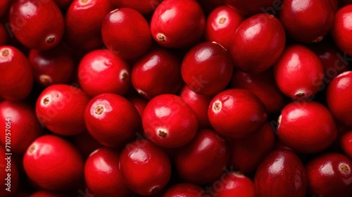  a pile of red cranberries sitting on top of a pile of other red cranberries on top of each other.