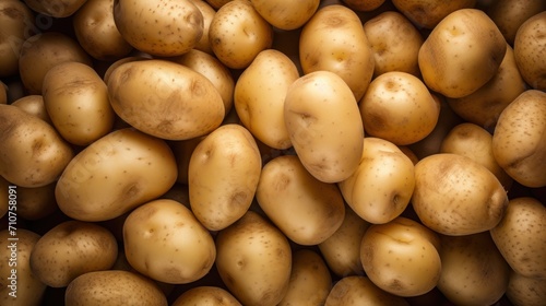  a pile of potatoes sitting next to each other on top of a pile of other potatoes next to each other.