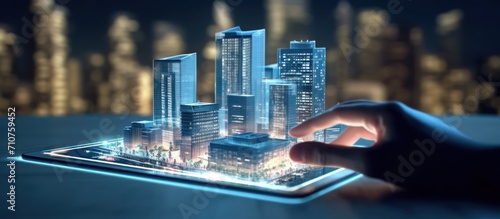 a man using a digital tablet, and a hologram of a modern building.