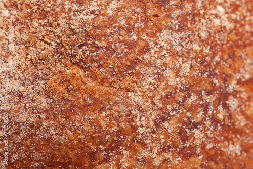 The texture of the crust of bread. Tasty fresh bread, close up.