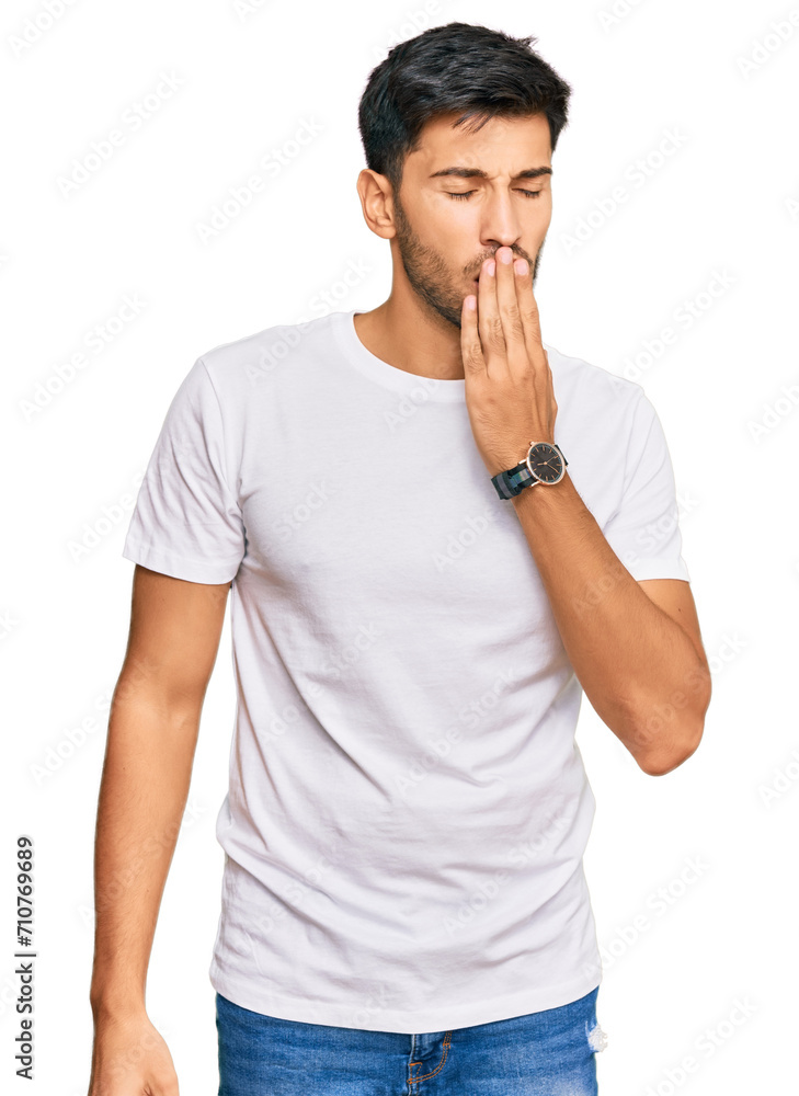Young handsome man wearing casual white tshirt bored yawning tired covering mouth with hand. restless and sleepiness. Young handsome man wearing casual white tshirt bored yawning tired covering mouth with hand. restless and sleepiness.