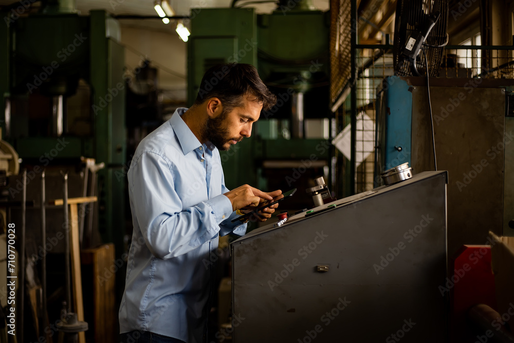 The engineer supervises the production of electrical devices in the factory. The engineer supervises the production of electrical devices in the factory.