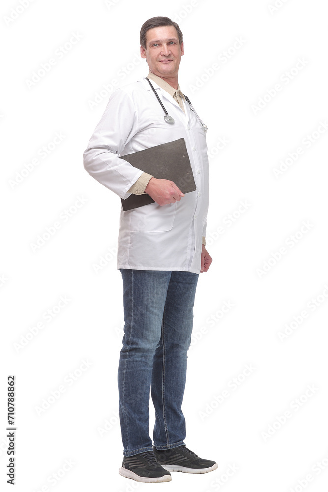 Young male doctor pointing and looking at the camera with a clipboart in his hand and a smile on his face. Young male doctor pointing and looking at the camera with a clipboart in his hand and a smile on his face.