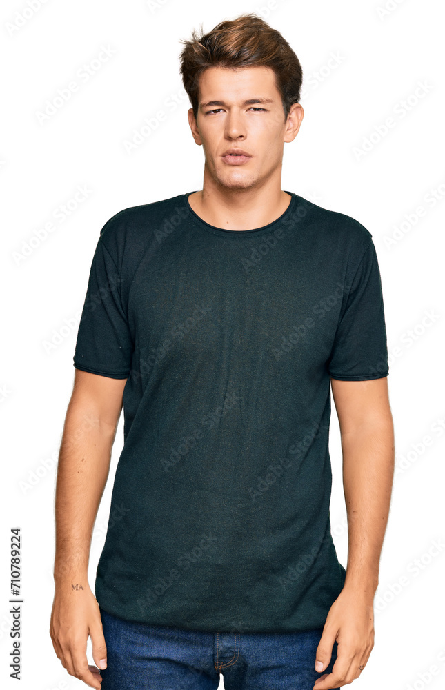 Handsome caucasian man wearing casual clothes relaxed with serious expression on face. simple and natural looking at the camera. Handsome caucasian man wearing casual clothes relaxed with serious expression on face. simple and natural looking at the camera.