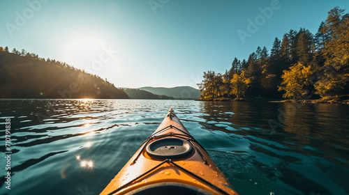 Front of an bright yellow kayak in clear water lake, beautiful nature infront