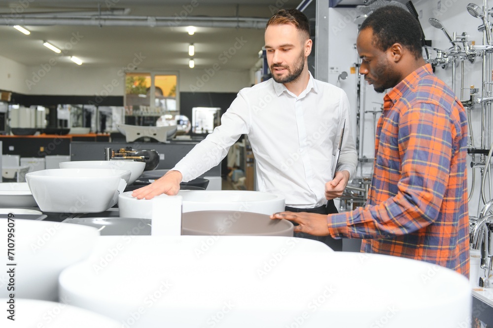 Obraz premium African customer with salesman in store for the house