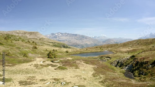 Aerial: Drone Forward Beautiful View Of Semi Arid Rock Formations Against Sky On Sunny Day - French Alps, France