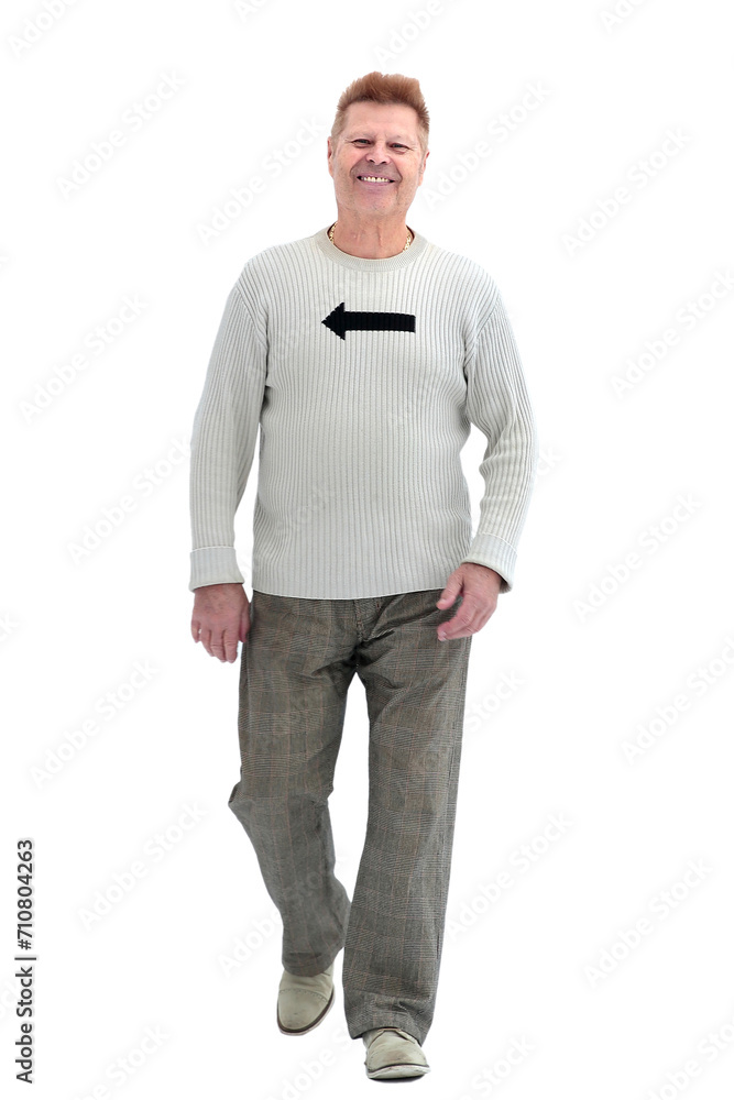 Fototapeta premium in full growth. cheerful man striding energetically forward