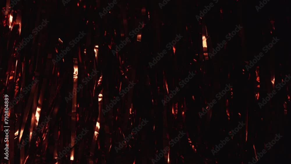 Background of red tinsel with iridescent light. Party concept Background of red tinsel with iridescent light. Party concept