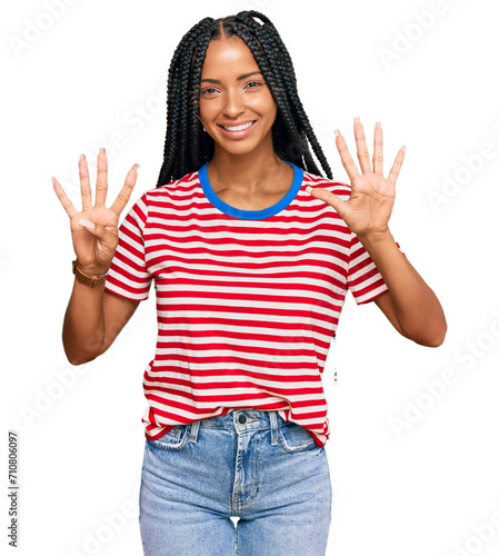 Beautiful hispanic woman wearing casual clothes showing and pointing up with fingers number nine while smiling confident and happy.