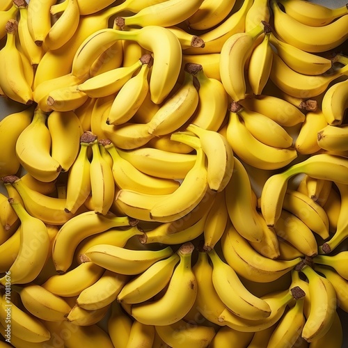  a large pile of ripe bananas sitting on top of a pile of unripe bananas on top of a table.