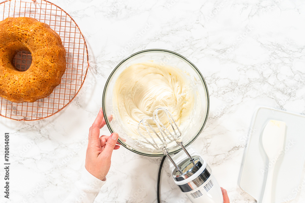 Fototapeta premium Creamy Bliss: Cream Cheese Buttercream for Carrot Bundt Cake