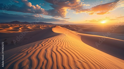 Sand dunes in the desert at sunset. Natural landscape background.