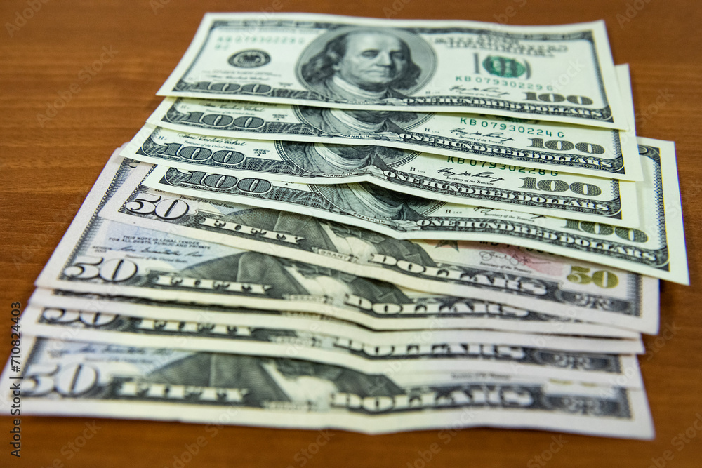 Thick wad of money cash on table Thick wad of money cash on table