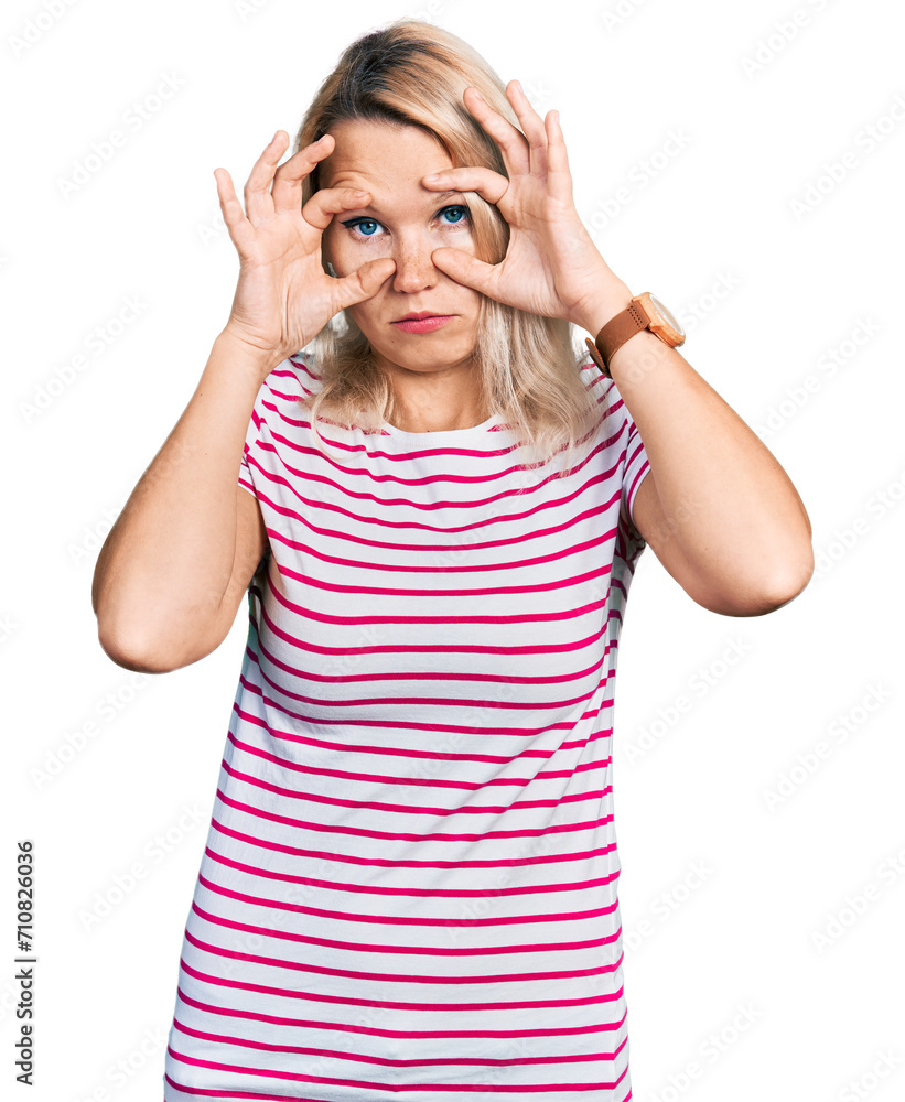 Young caucasian woman wearing casual clothes trying to open eyes with fingers, sleepy and tired for morning fatigue Young caucasian woman wearing casual clothes trying to open eyes with fingers, sleepy and tired for morning fatigue